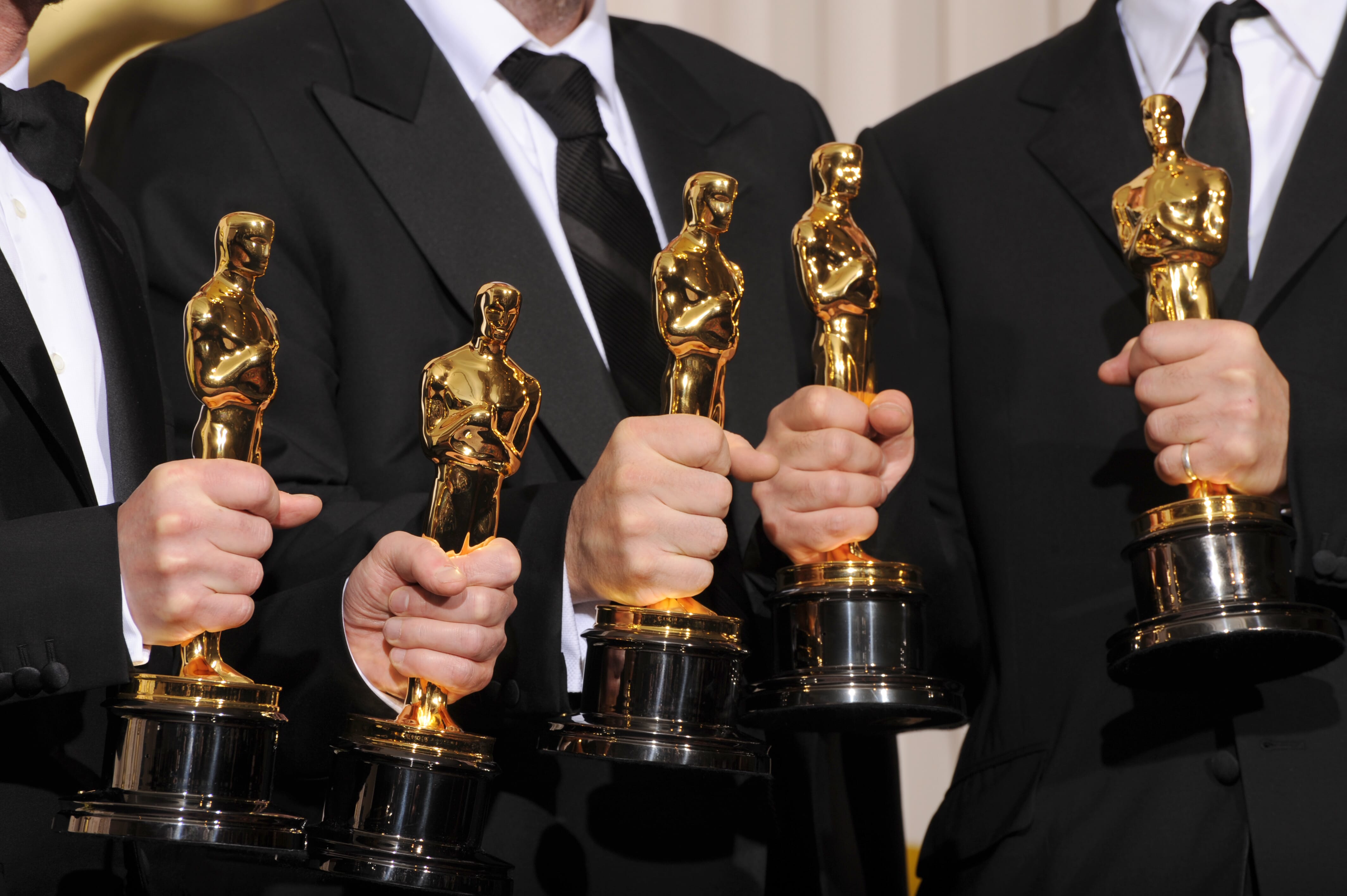 Photo of Oscar winners holding their trophies